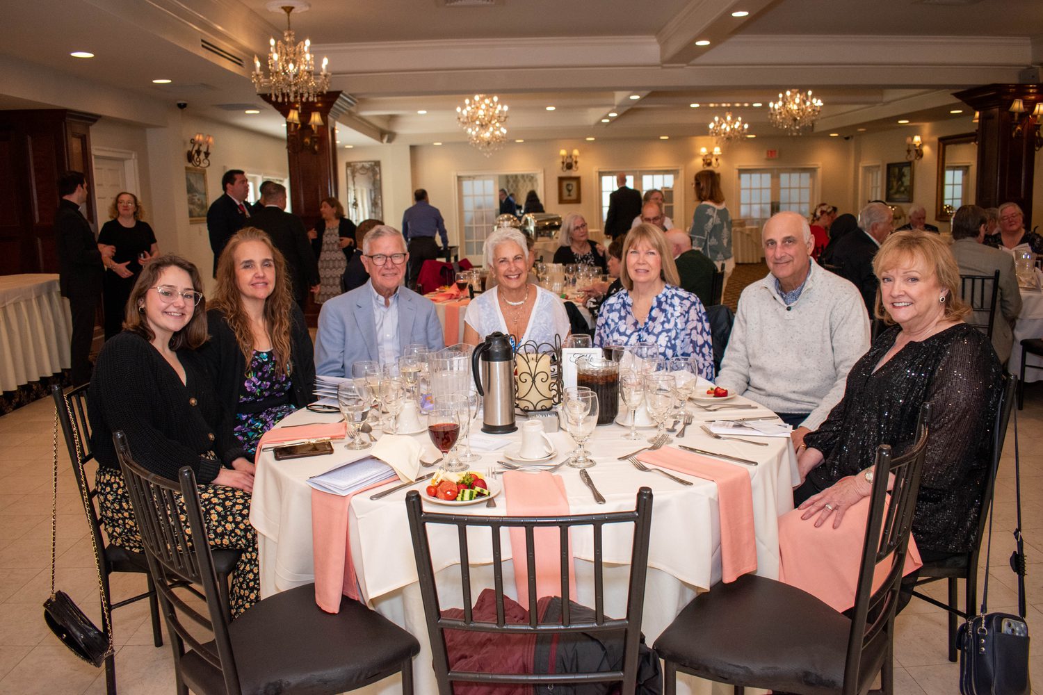 Guests seated together at one of the dinner tables