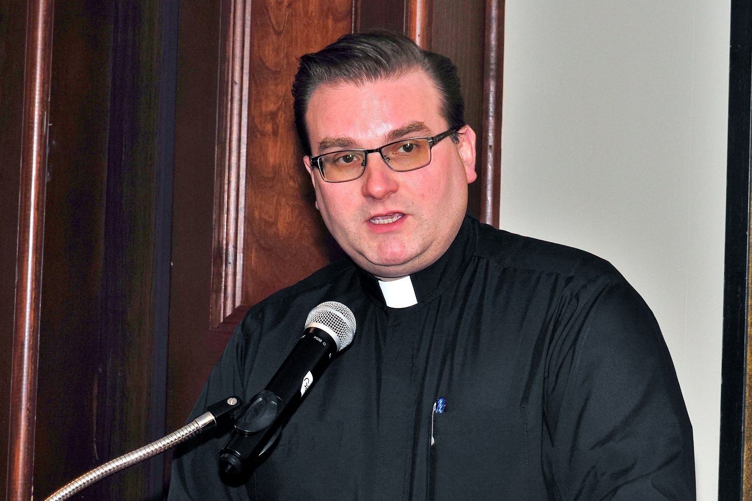 Father Turner addressing the room