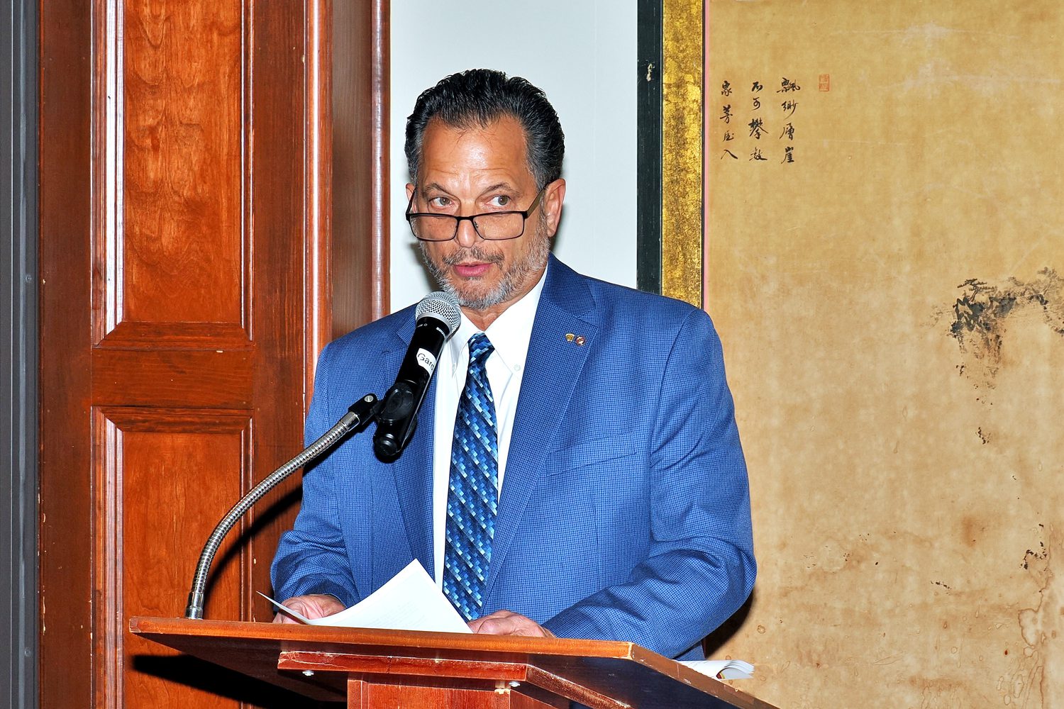 Phil, the master of ceremonies, speaking from the podium
